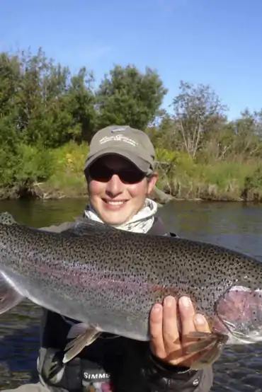 Large Copper River rainbow trout held by an angler