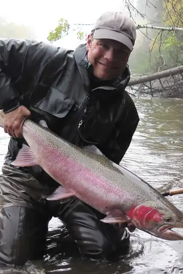 Steelhead Valhalla Lodge angler with Sustut River steelhead