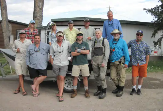 Guide school students practicing fly fishing skills on the water